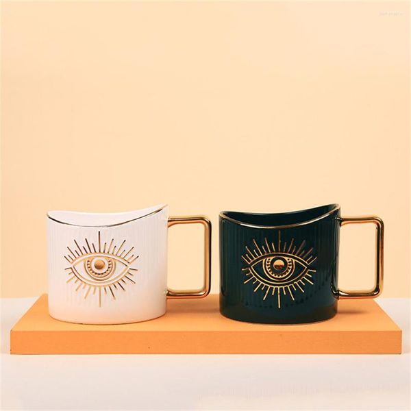 Garranhas de armazenamento Creative Cerâmica Branco Creca de café Big Eye Com alça de ouro de grande capacidade de leite Copo de talheres em casa Acessórios