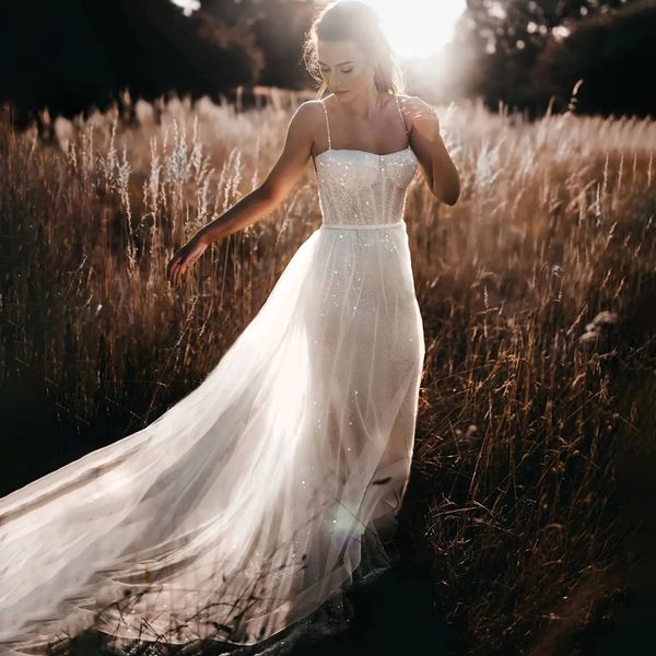 Abiti da sposa a sirena con perline lucide Cinturino per spaghetti Staccabile Treno Abito da sposa da spiaggia Abito da sposa Boho con paillettes senza schienale