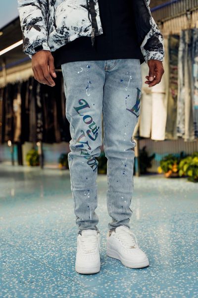 Jeans da uomo Jeans skinny con schizzi di vernice Man Patch afflitto Acquista pantaloni da moto in denim strappato strappato di moda da uomo 230516