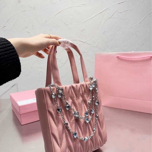 23 Mini borsa a pieghe all'inizio della primavera Borsa a mano con diamanti ad acqua Dolce manuale musicale a spalla singola Oblique Straddle Women 230519