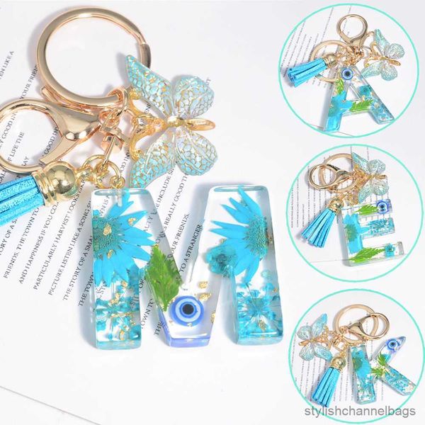Chaveiros criativos azuis azuis little margarida seca Keychain Butterfly Ring Key Saco feminino Tassel Pingente Titular
