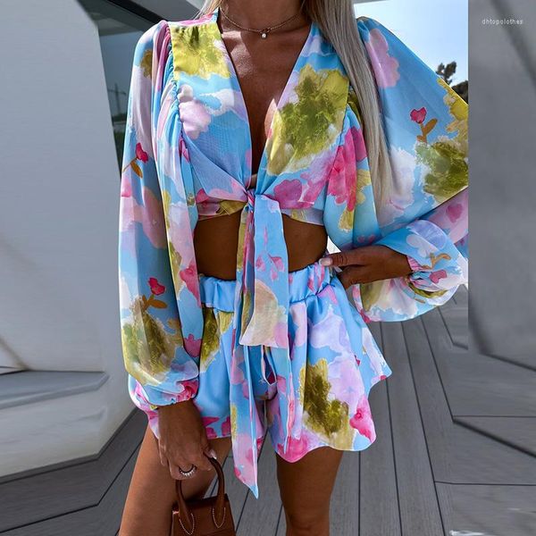 TRABALHOS FEMNIMAIS FILMA PRIMEIRA FLORAL Terno de duas peças Blusa de top hollow de laço sexy de arco e calças elásticas de cintura de verão chiffon