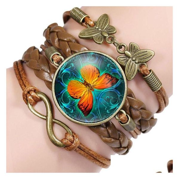 Braccialetti con ciondoli Vintage Farfalla in pelle per le donne Cabochon in vetro Tessitura animale Corda Avvolgere Braccialetto Gioielli di moda Regalo Drop Delivery Dh9Jo