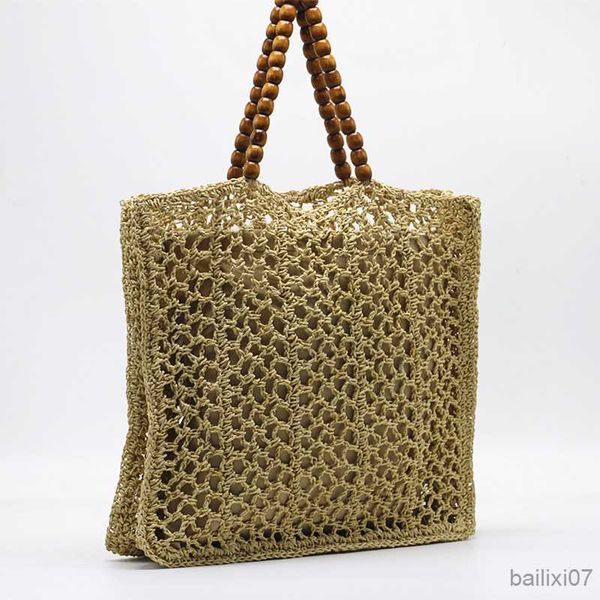 Andere Taschen Sommer Holz Perle Griff Stroh Tasche Mode Hohl Stroh Frauen het Schulter Tasche Casual Strand Tasche Große Tote Shopper geldbörse