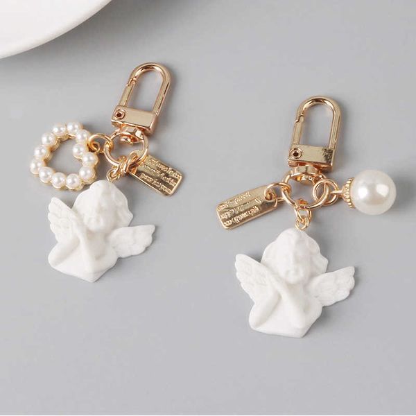 Anéis -chave criativos retrô de anjo branco anjo feminino Mini pérola de pérolas Chavejador de keyring titular buging saco de charme jóias g2305526