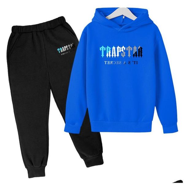 Set di abbigliamento Marca Trapstar Tuta stampata Ragazzi e ragazze 2 pezzi Felpa con cappuccio Pantaloni da jogging Tuta 411 anni Abbigliamento per bambini 230803 D Dh4Gs