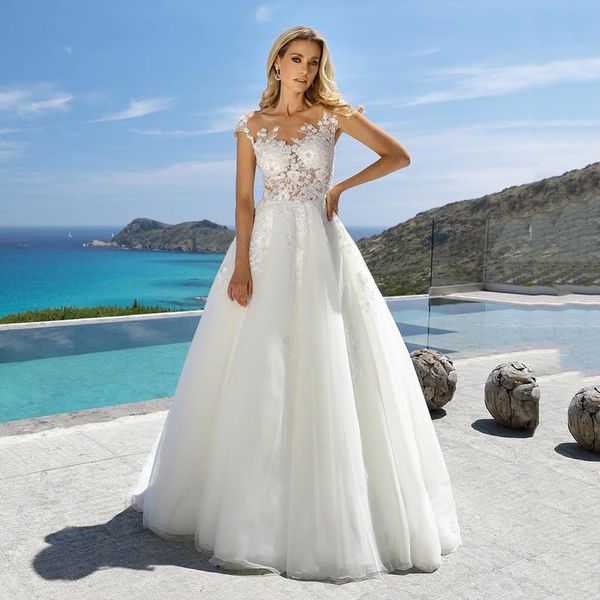 Abito da sposa gioiello con spalle scoperte per la sposa Applique in tulle con bottoni ricoperti di cavità senza maniche personalizzato