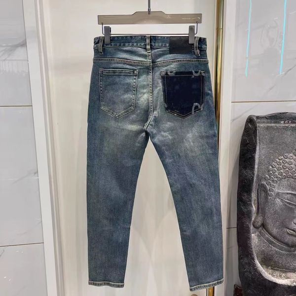 Designer de jeans masculino impresso adesivos carta personalizada vintage lavagem jeans solto estiramento lavagem reta resistente ao desgaste superior linha remendo calças casuais