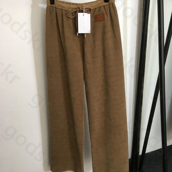 Pantaloni a gamba larga con etichetta in pelle Pantaloni a vita alta con stampa di design da donna Pantaloni larghi a vita elastica alla moda