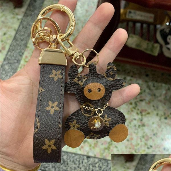 Schlüsselanhänger Kuhketten Zubehör Braune Blume Teddybär Pu-Leder Auto Schlüsselanhänger Schmuck Frauen Männer Mode Tier Tasche Charms Anhänger Dhuiu