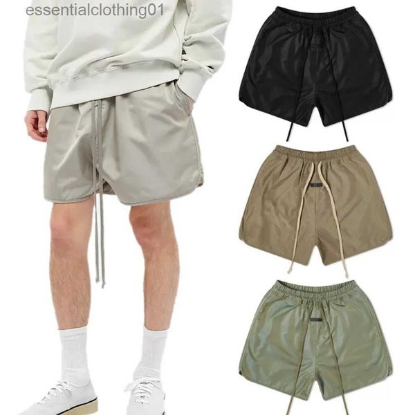 Herren -Shorts Sommer Dr. Feste Farbe Schnell trocken coole Shorts gewebt Nylon Herren und Frauenelbe Stil Lose Fünf -Punkte -Jogginghose L231212