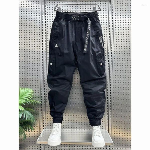 Pantaloni da uomo 2024 Primavera e Autunno Nero Allentato Casual Corsetto Rete di carico Rosso Sottile Versatile Piccoli piedi Cropped Harem