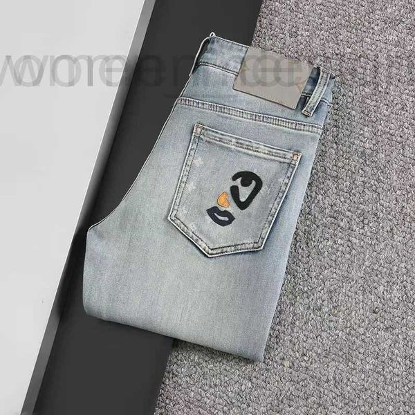 Jeans da uomo Designer designer di lusso Lavaggio classico con lettere floreali Cilindro dritto di lusso Pantaloni da lavoro vintage elasticizzati da moto con toppa superiore resistente all'usura