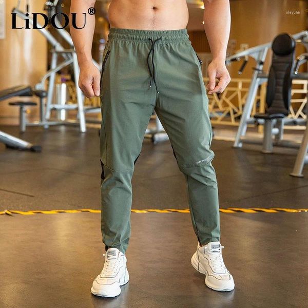 Calças masculinas 2023 verão estilo fino gelo seda tecido movimento calças homem cor sólida cintura elástica secagem rápida solta musculação sweatpants