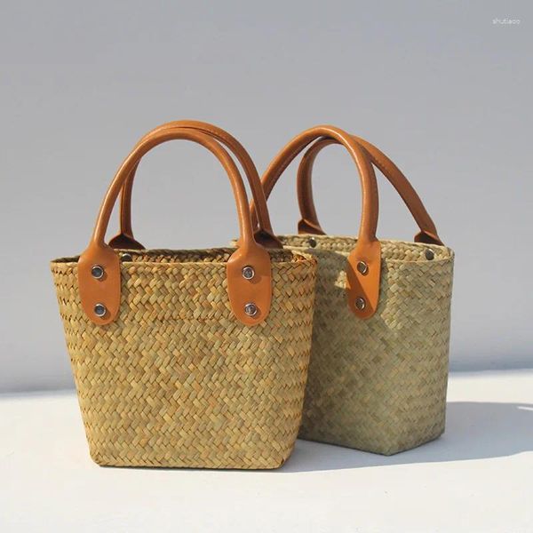 Marsupi 1pc Borsa di paglia Intrecciata a mano Design di nicchia transfrontaliero Mano Borsa semplice da donna Vacanza al mare Spiaggia Grande capacità