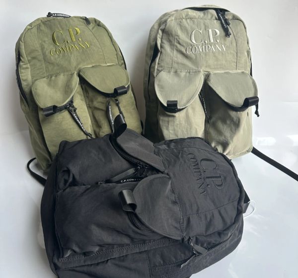 2024 Unisex Fashion Men CP Nylon gesticktes Buchstaben Logo Rucksack Sport Outdoor Casual Packs Bag Wander Mountain Klettern Multifunktionale Tasche