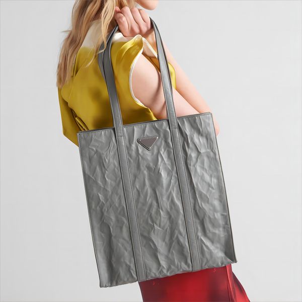 Top -Qualität Designer -Einkaufstasche Einkaufstasche Echtes Leder handgeschnittener Effekt Metalldreieck Logo Große Kapazität Alltagsbag Mode Hangbag