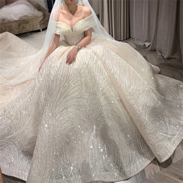 Abito da sposa con paillettes con spalle scoperte Maniche lunghe Abiti da sposa di lusso Robe De Mariee Maniche da principessa Abito da sposa romantico Abiti da sposa