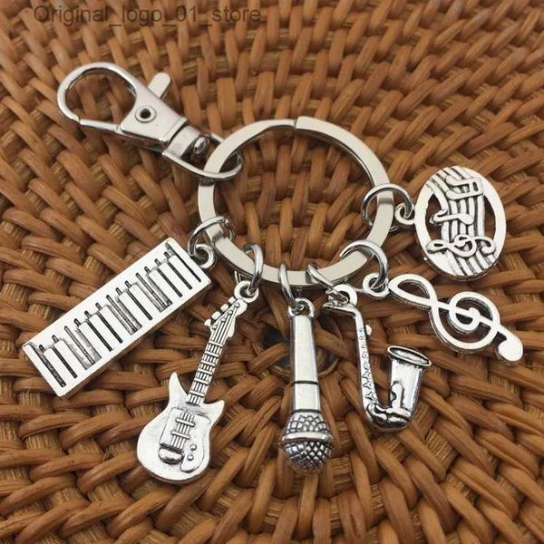 Schlüsselanhänger Lanyards Saxophon Noten Mikrofon Gitarre Band Musik Schlüsselanhänger Schlüsselanhänger Silber Farbe Frauen Schmuck Mann Accessoire Anhänger Mode Geschenk Q231220