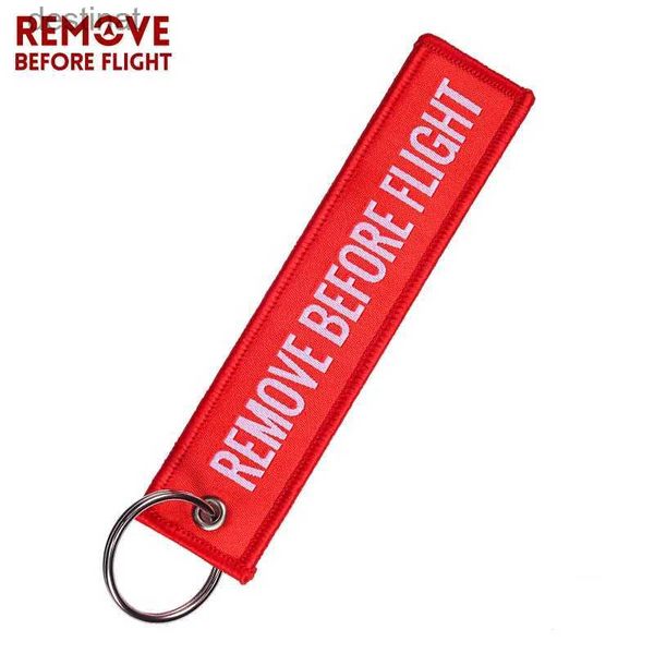 Anelli chiave Rimuovi prima del volo Etichetta per etichetta per etichetta per bagagli speciali per il portachiavi della catena rossa per regali aeronautici per portachiavi OEM Fashion JewelryL231222