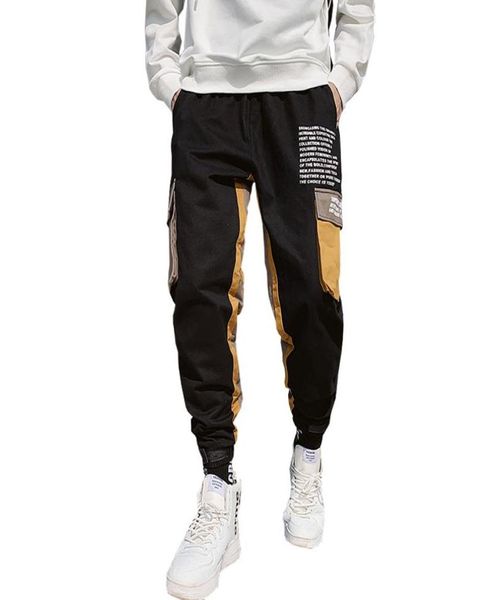 Homens Black Joggers calças casuais fitas masculinas grandes bolsos de harém de cargo masculino massache de rua de rua de primavera.