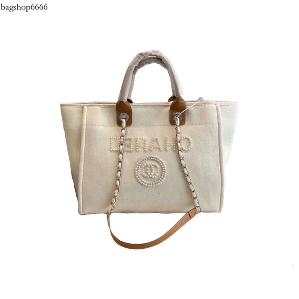 Designer Summer Beach Bolsa C Letter ombro Flash Office High Quality Saco de lona de alta qualidade com botão Retro Feminino Feminino 2024 NOVO