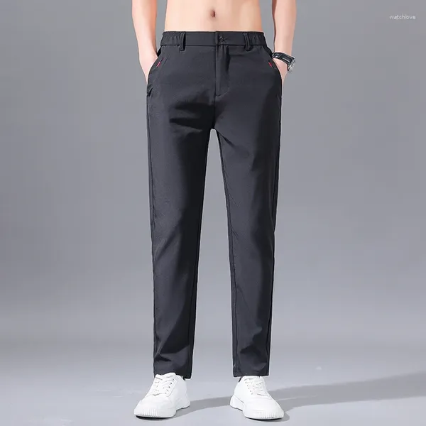 Pantaloni da uomo Primavera Autunno Elastico a vita alta Tasca con cerniera con bottoni solidi Pantaloni larghi da lavoro Pantaloni da lavoro Moda formale