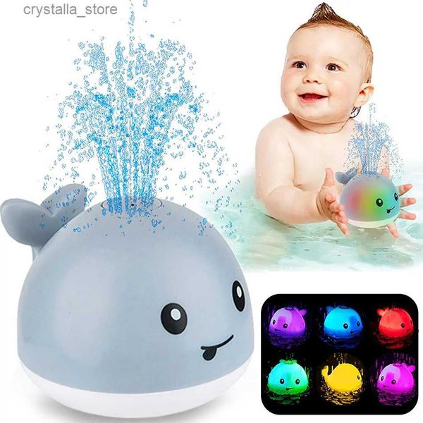 Baby Light Up Bath Tub Toys Whale Water Sprinkler Pool Toys per i più piccoli Neonati Whale Water Sprinkler Pool Toy