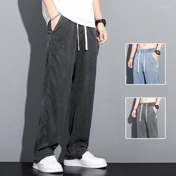 Calça jeans masculina de tecido macio com cordão na cintura elástica folgada e reta fina coreana casual tamanho grande M-5xl