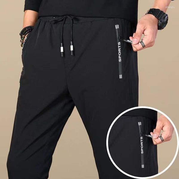 Pantaloni da uomo Casual Primavera Autunno Tasca con cerniera Pantaloni sportivi traspiranti Elasticità Pantaloni ad asciugatura rapida Attillati maschili dritti