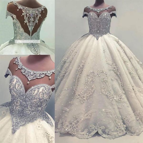 Designer de luxuosos cristais frisados árabe vestido de baile vestidos de noiva 2018 mais recente transparente mangas curtas miçangas lantejoulas bufantes longo brida252w