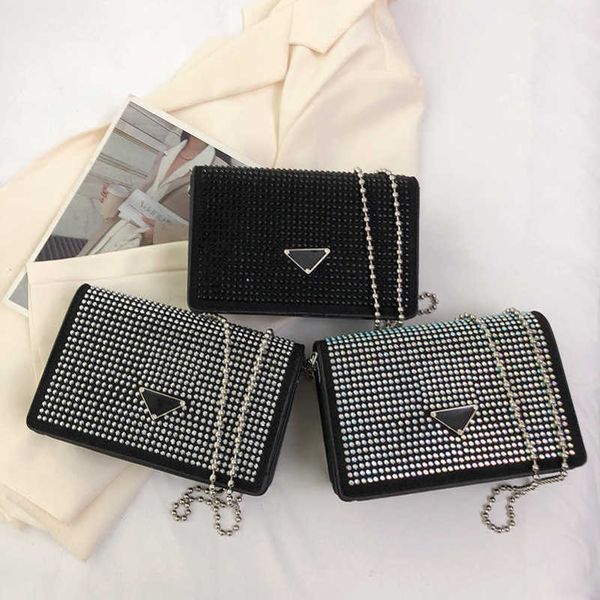 2023 Vendite dirette in fabbrica di alta qualità Water Diamond Women's Small Square Primavera / Estate New Chain Shoulder Lipstick Headphone Mini Crossbody Bag