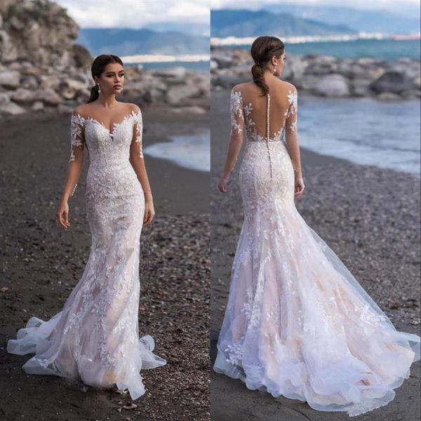 2020 Abiti da sposa da spiaggia a sirena in pizzo a maniche lunghe trasparenti con collo gioiello Appliques Illusion Sweep Train Dubai Abiti da sposa con Butto237m