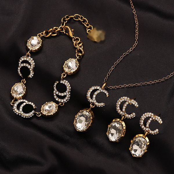 Retro Gold Monogram Designer Jewelry Set with Crystal Rhinestones - Necklace, moon crystal bracelet, Earrings in Black, Red, and White - Perfect Gift for Fashionable Family and Couples