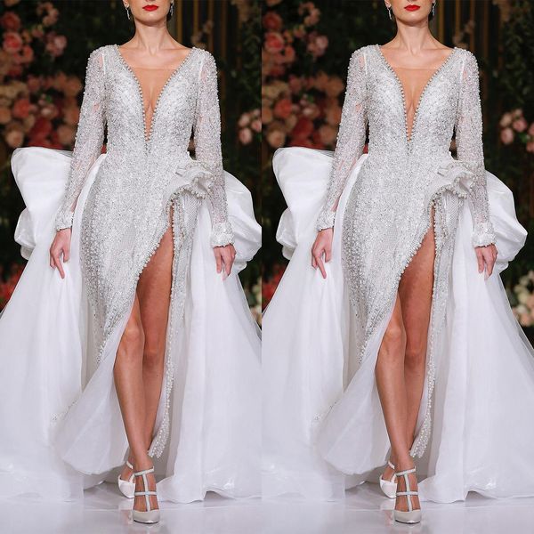 Abito da sposa moderno a sirena Vedere attraverso scollo a V profondo Perline Abiti da sposa Abito da sposa a maniche lunghe con spacco laterale su misura con grande fiocco