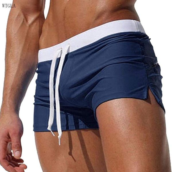 Mutande 2023 Boxer da uomo estivi Moda Quick Dry Tasca posteriore Design Tinta unita Appartamenti Pantaloncini da bagno da spiaggia PER UOMO Tronchi con coulisse