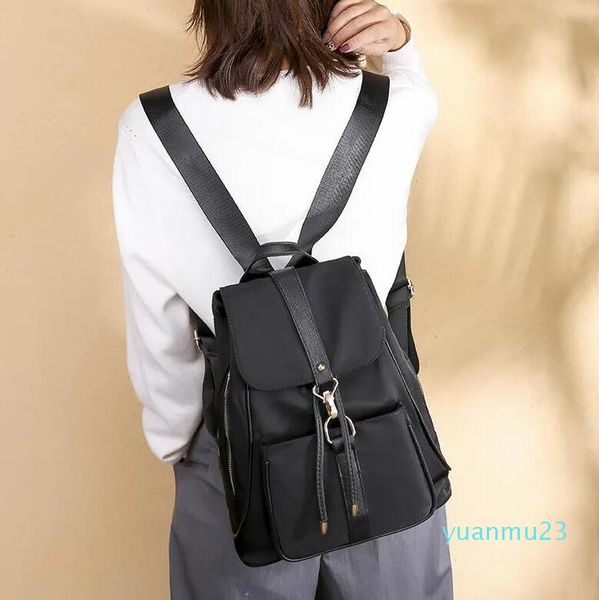 Bolsas ao ar livre 2023 impermeabiliza 24 Backpack de pano versão coreana feminina da bolsa de lona de nylon de viagem selvagem sólida
