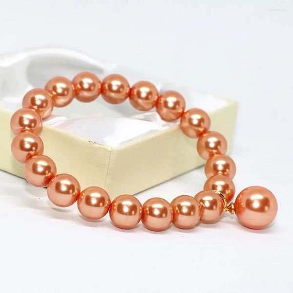 Strang Design Charms Orange Shell simulierte Perle 10 mm runde Perlen Fabrikauslass Frauen Armband Elastizierseil Schmuck 7,5 Zoll B1714