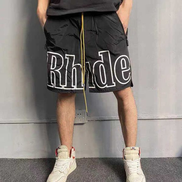 Pantaloncini da uomo Rhude Summer Designer pantaloni da spiaggia New York limitata lettera riflettente stampa coulisse mesh casual high street 5 pollici sciolto SHORTS UOMO