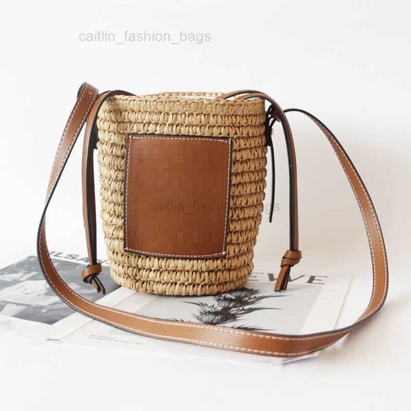 Borsa da spiaggia di design Estate Stile classico da donna Moda Borsa tessuta a mano pura Lafite Grass Summer Vacation Borsa tessuta Commercio all'ingrosso di alta qualità