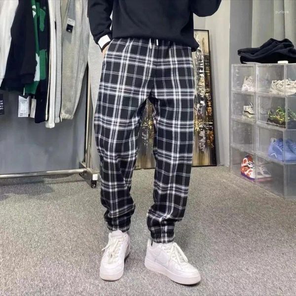 Pantaloni da uomo Uomo Mazzo di piedi Moda sciolto plaid nero Autunno inverno ispessimento calore Harajuku Streetwear Harem pantaloni maschili