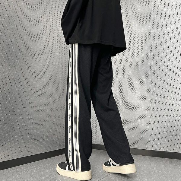 Calças masculinas harajuku moda casual homens solto lado listrado perna larga cintura elástica streetwear fitas masculino calças pretas 5xl