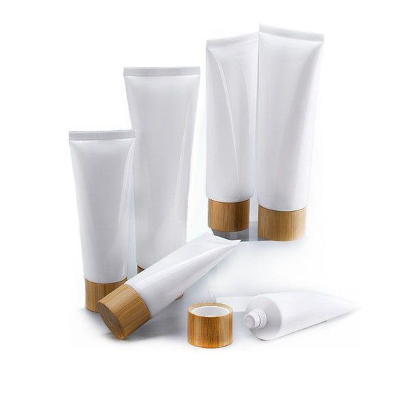 Leere weiße Kunststoff-Quetschröhrchen, kosmetische Cremetiegel, nachfüllbarer Reise-Lippenbalsam-Behälter mit Bambuskappe, Moswa