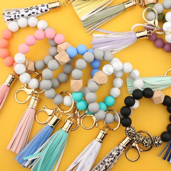 Chaveiros de silicone miçangas de madeira para chaves de pulseira de pulseira de pulseira Keyring Women Tassel Charms Acessórios por atacado