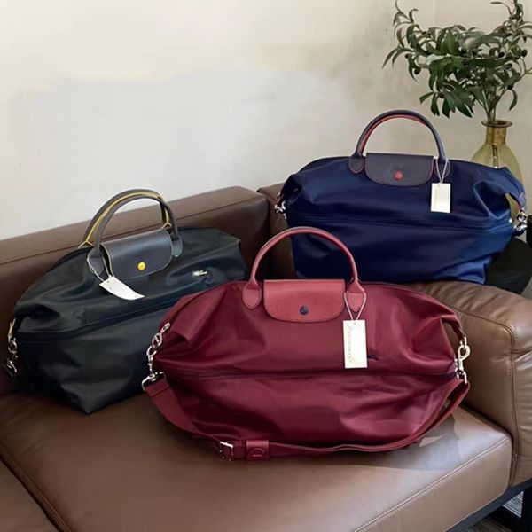 Commercio estero Nuova borsa da viaggio in nylon da ricamo plus-size Borsa da viaggio unisex Borsa a tracolla pieghevole a tracolla all'ingrosso