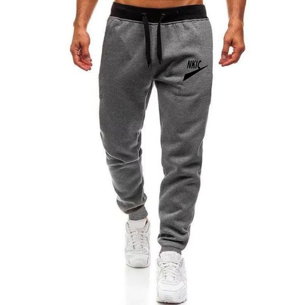 Cal￧a de corrida de treinamento de gin￡stica joggers homens puxadores de cordas esportivas de cal￧a de moletom de moda moda trackpants de fundo casual logotipo de marca de marca impress￣o