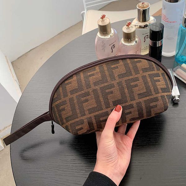 Bolsas de cosméticos Casos viagens de produtos de higiene pessoal feminino armazenamento portátil de grande capacidade Hand segurando carteira simples saco de celular de maquiagem