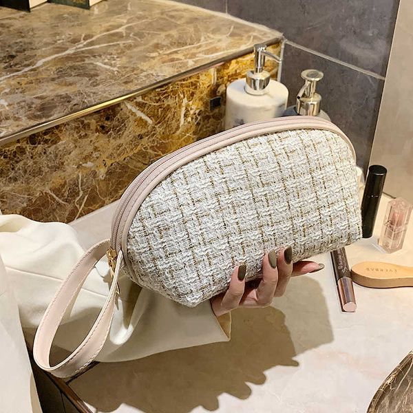 Astucci per cosmetici Astucci per trucco Conchiglia semicircolare da donna fuori piccola mano Piccola borsa per il lavaggio semplice e portatile