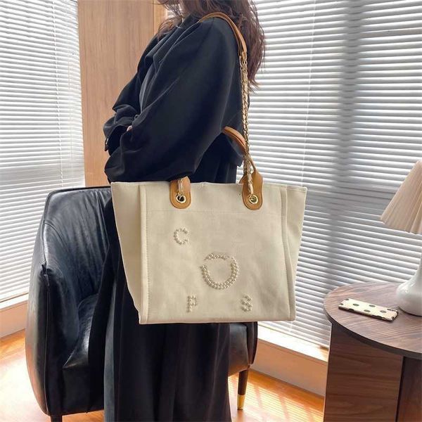 Bolsa de compras de marca de designer 2023 novo ombro mensageiro feminino Tote Tote Pearl Pérola de grande capacidade Handbag feminina por atacado