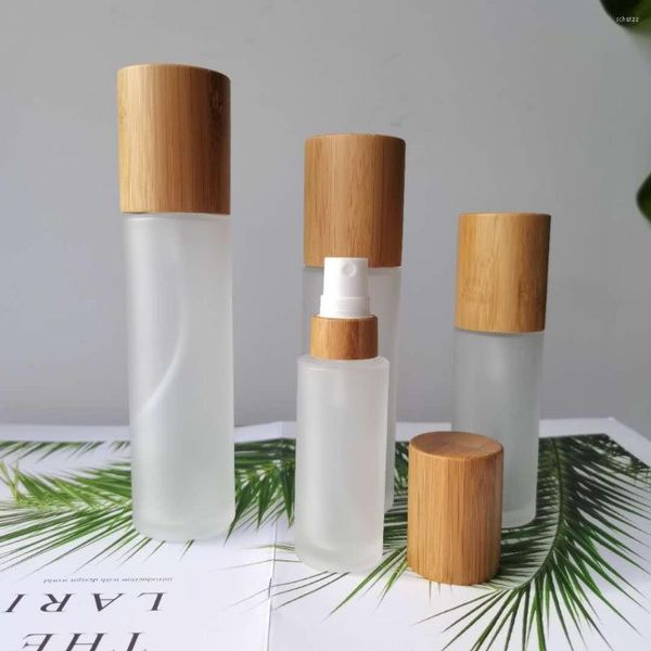 Garrafas de armazenamento garrafa de tampa de bambu cosmética de vidro fosmético com bomba de spray para pacotes de cosméticos 100ml 120ml 150ml Logotipo de gravura